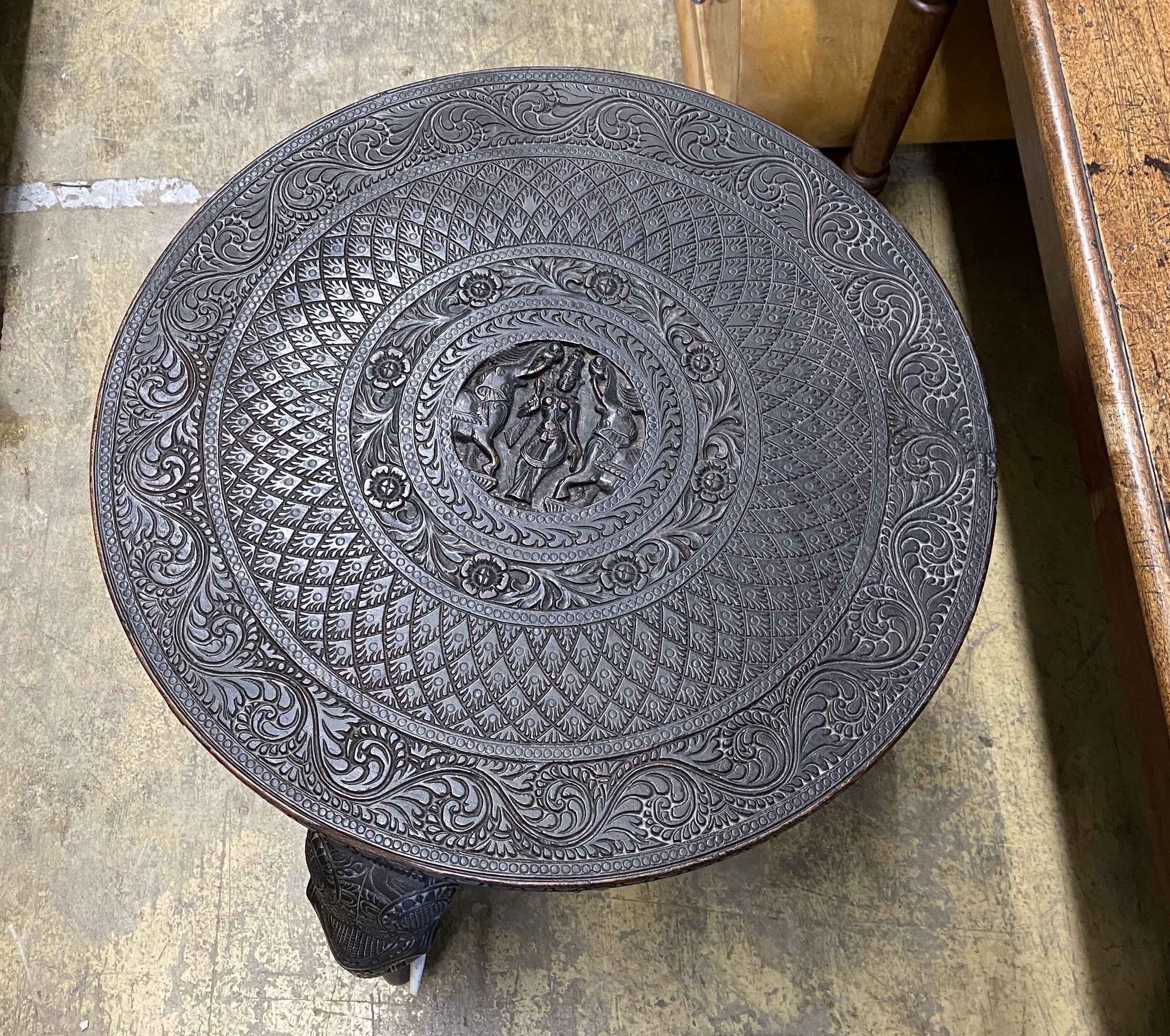 An Indian circular carved hardwood occasional table, diameter 60cm, height 63cm